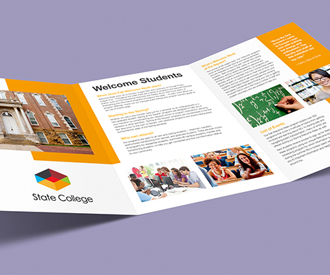 A large, open tri-fold brochure sits on a purple background. The brochure is for state college with numerous images of people around campus and unreadable text.