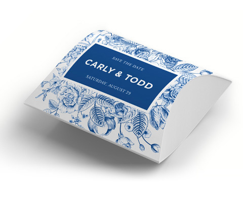 Rectangular 3D event package with blue flowery design and a solid block in the center with white text that reads Carly & Todd