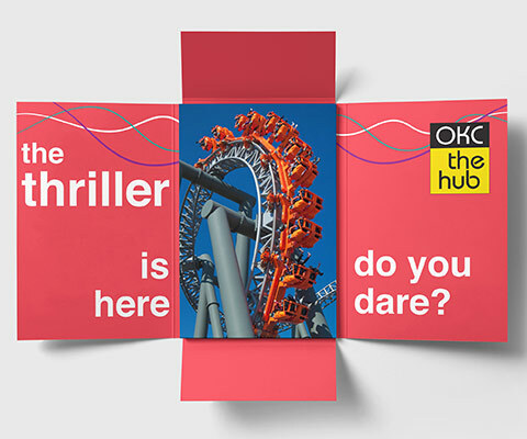 A four-panel fold out invite with a red inside that reads "the thriller is here. do you dare?" and an OKC the hub logo on the right. An image of a rollercoaster ride sits in the center.